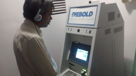 Ketan Kothari, manager (advocacy), Sight savers India using Corporation bank Talking ATM at Saint Xavier's College, Mumbai